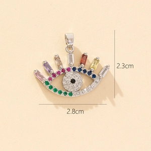 Macro shot showing evil eye pendant dimensions 2.3cm by 2.8cm with colorful zircons