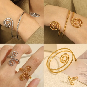 Minimalist spiral wrap bracelet and ring set in gold and silver finish with open design