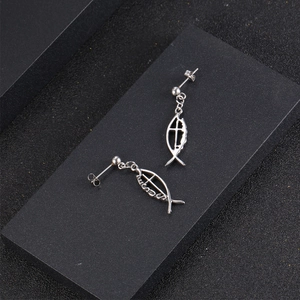 Titanium steel Ichthys fish earrings with Jesus engraving on a black display stand