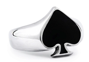 Macro detail of stainless steel ring with black enamel spade symbol and polished finish