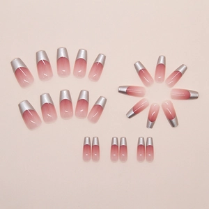 Detailed flat lay of 24pcs pink gradient press-on nails with silver chrome French tips