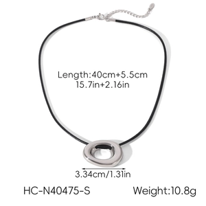 Detailed view of silver irregular oval pendant on black collar with measurement specs