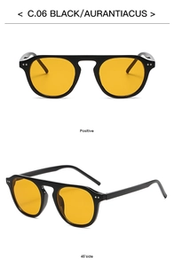 Flat top black sunglasses with orange lenses and decorative rivet detail, front and side views
