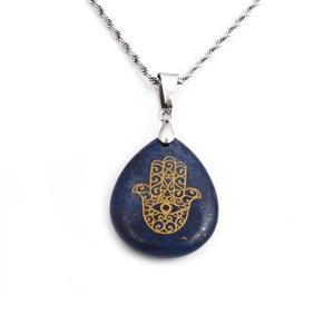 Lapis lazuli Hamsa Hand pendant necklace on silver twisted chain over white background