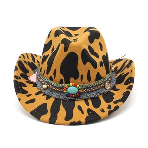 Detail of leopard print western hat with ethnic beaded band and turquoise stone decor