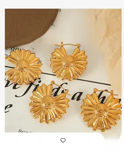 Detailed view of hollow petal flower earrings with 18K gold plated textured finish