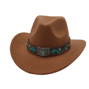 Detail of a brown wool felt cowboy hat with embroidered leather band and metal buckle