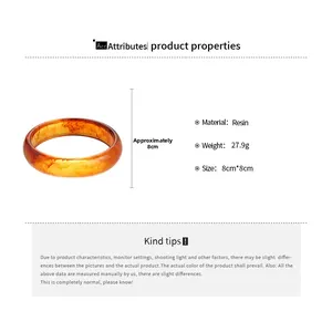 Detail view of amber resin bangle showing dimensions 8cm by 8cm and 27.9g weight