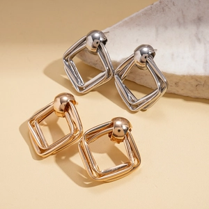 Minimalist geometric double rhomboid stud earrings in polished gold and silver metal finish