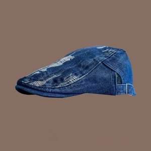 Retro distressed dark blue denim beret hat with vintage washed details and side view