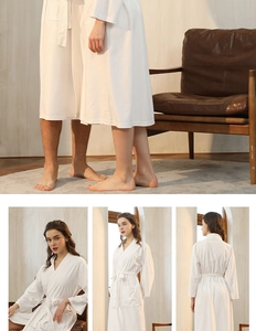 Detail view of white waffle knit bathrobe with long sleeves and adjustable waist belt
