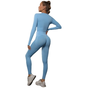Seamless light blue two-piece yoga set with long sleeve crop top and high waist leggings