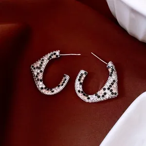 18K gold-plated C-shaped stud earrings featuring leopard pattern zircon stones