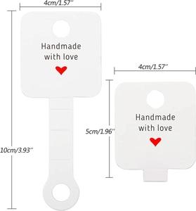 Macro view of white jewelry display cards showing precise 4cm and 10cm dimensions