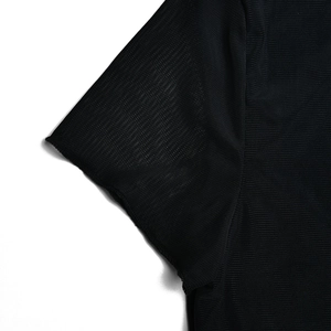 Detailed macro view of black mesh fabric sleeve with professional stitching and texture