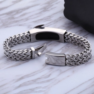 Men's double-row stainless steel bracelet with industrial side-press clasp on marble