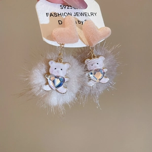 Detail of S925 silver needle earrings with pink plush hearts and white fur ball bear pendants