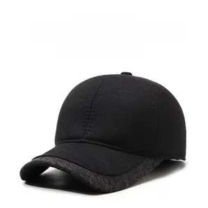 Detail view of winter baseball cap with ear protection and a shield metal badge