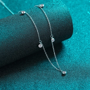 Elegant S925 sterling silver moissanite necklace with round stones on teal background