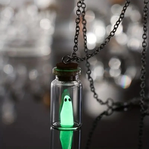 Luminous ghost in glass bottle necklace with dark chain and mysterious glow effect