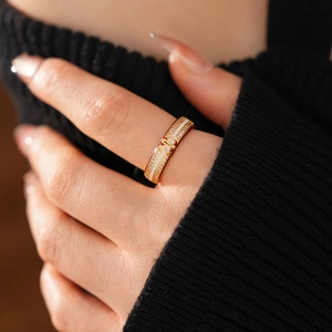 Detailed view of 18k gold plated enamel ring with cross pattern and zircon stones