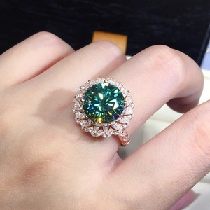 Close-up of luxury halo ring featuring a brilliant green zircon set in rose gold plating