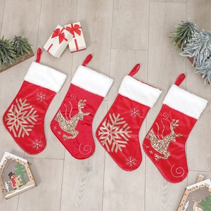 Set of four red and white Christmas stockings with gold sequined reindeer and snowflakes