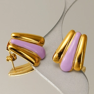 Macro detail of 18k gold plated fan-shaped earrings with lavender enamel finish