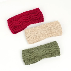 Detailed knit texture of wide winter headbands in burgundy, beige, and olive green