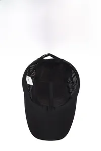 Macro detail of breathable mesh fabric and adjustable strap inside the black sports cap