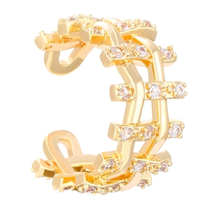 Macro shot of multi-layer gold heart ear cuff with sparkling zircon stone inlay