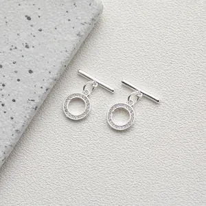 Macro detail of silver plated 14K gold OT toggle clasp with cubic zirconia inlay for DIY jewelry