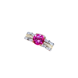 Pink sapphire engagement ring with pavé diamonds and two-tone silver gold band
