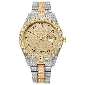 Detailed close-up of a luxury iced-out watch with gold-tone dial and Roman numeral calendar