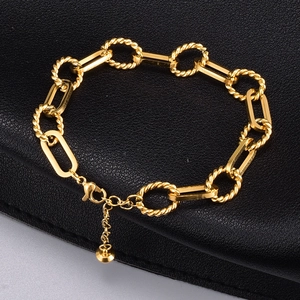 Minimalist 18K gold chunky chain bracelet with twist links and extender on black leather