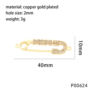 Macro shot of 40mm gold-plated copper safety pin charm with crystal heart and size specs