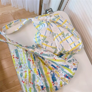 Close-up of floral cotton tote bags with colorful stripes in French pastoral style