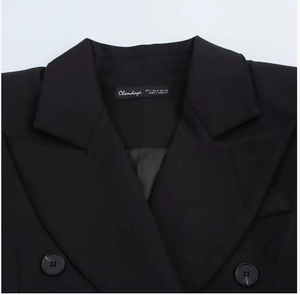 Detail view of the black satin blazer neckline with button and size label