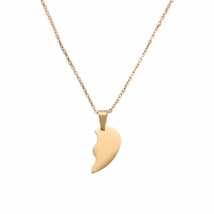 Close-up of a minimalist rose gold split heart pendant with a fine link chain necklace