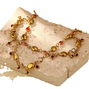 18K gold plated necklace with red and clear water drop stones on mineral stone