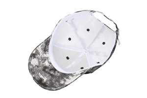 Detail view of tie-dye baseball cap interior with stitching, vents, and metal buckle strap