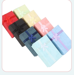 Detailed top view of colorful jewelry gift boxes with elegant ribbon bow decorations