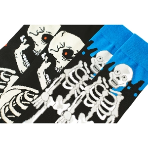 Knit crew socks featuring unique white skull patterns on black and blue cotton blend fabric
