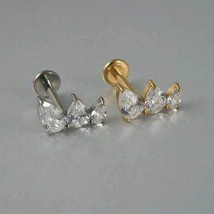 G23 titanium labret studs featuring marquise zircon flowers in silver and gold tones