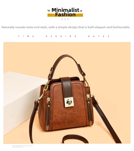 Close-up of brown vintage bucket bag with gold hardware and textured leather material