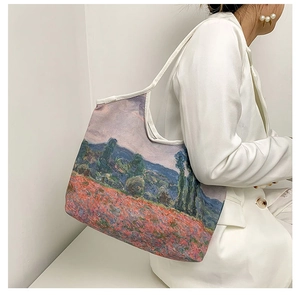 Detail of oil painting print on a large canvas tote bag showing artistic poppies