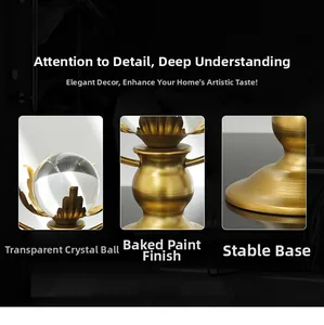 Detail of clear lotus crystal ball with gold lacquered metal stand and stable round base