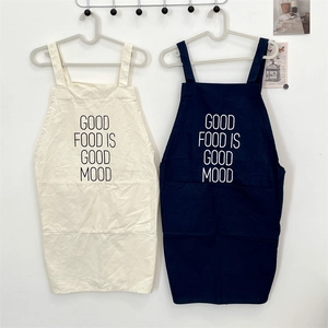 Detail of minimalist cotton linen apron with large front pockets and graphic print