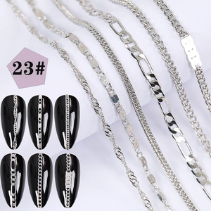 Macro detail of six silver nail art metal chains with creative textures and 3D design