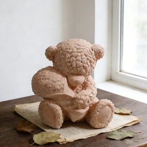 Macro shot of teddy bear silicone mold with detailed knit texture on a wooden desk